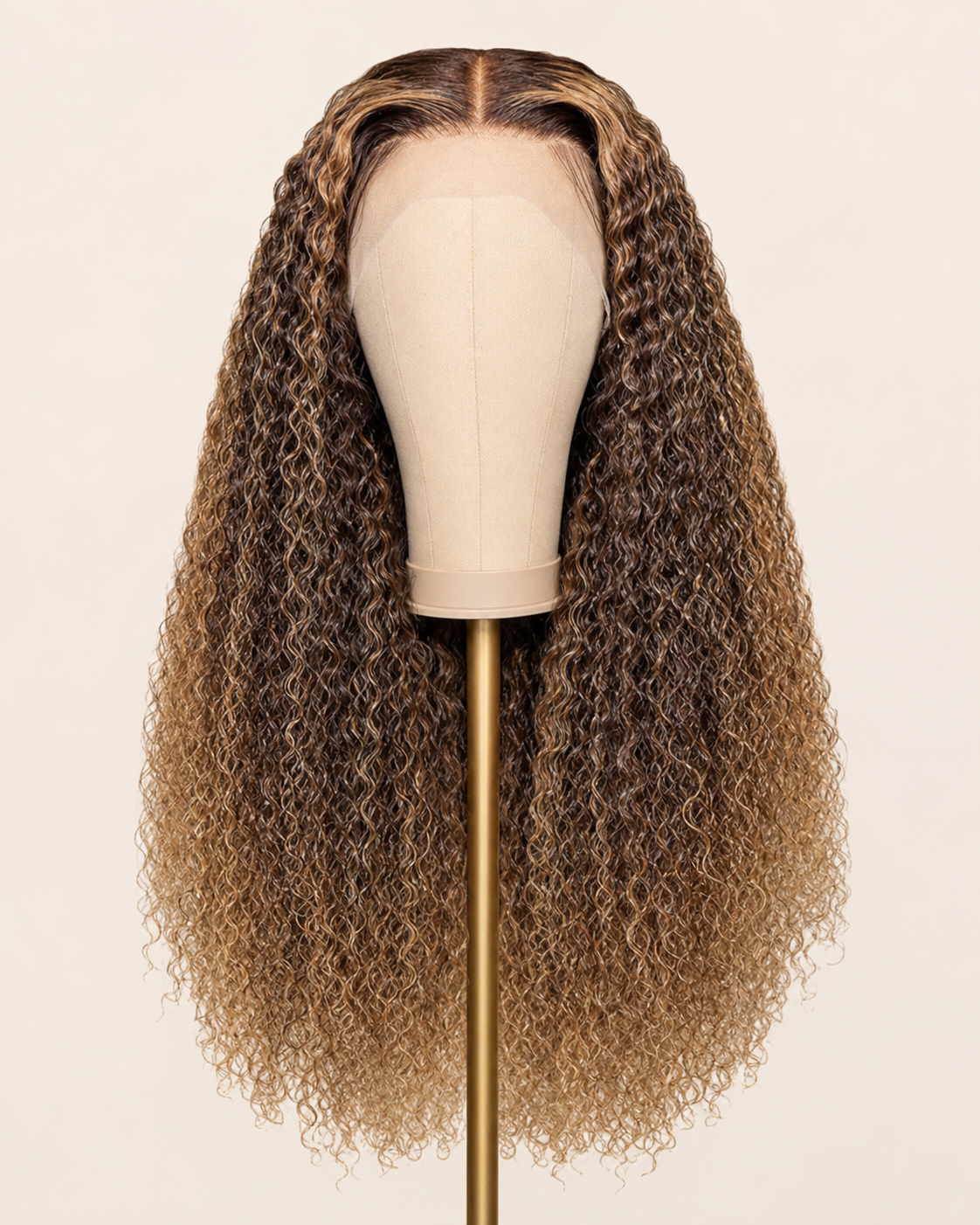 Perruque Bouclée Longue · Ombré Caramel présentée seule sur support